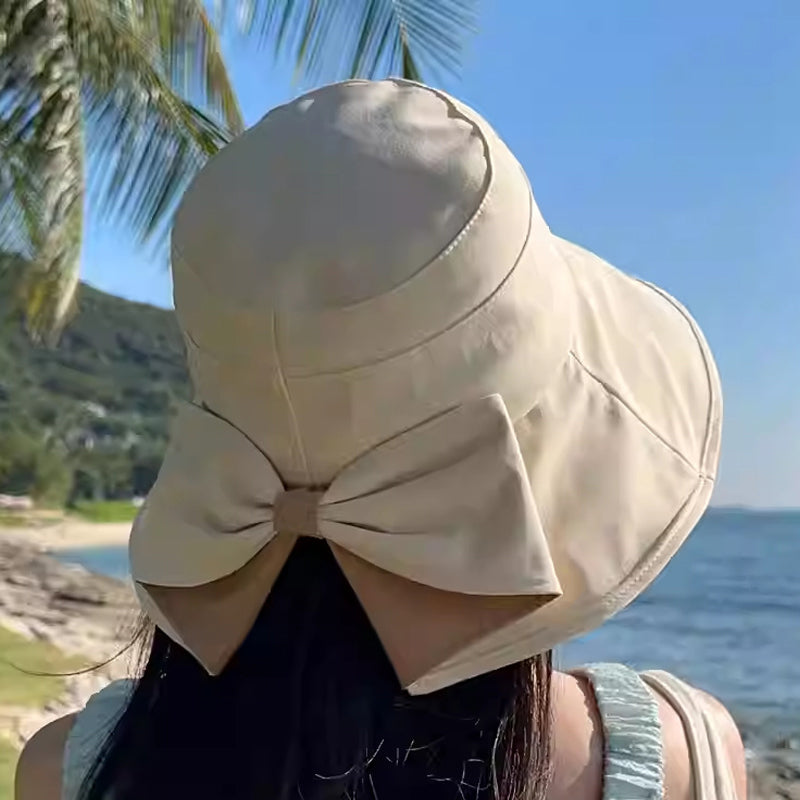👒 💐 Women's Bowknot Wide Brim Sun Protective Hat – Oversized wide brim blocks UV rays, delicate bow decor, lightweight breathable fabric, ideal for beach, travel & outdoor walking✨